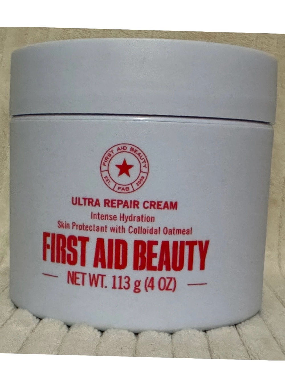 First Aid Beauty White Jar with Red Text Ultra-Hydrating Moisturizer